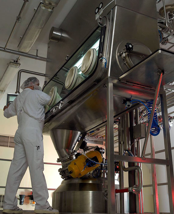 Worker engaged in the sterile crystallization manufacturing process