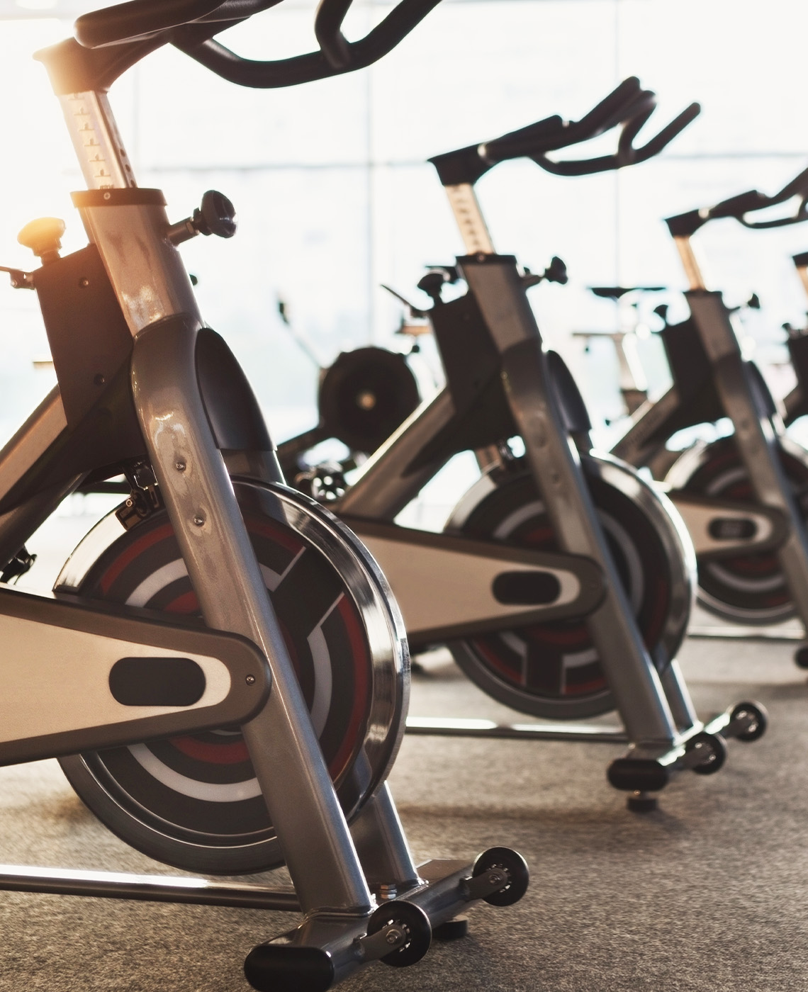 Modern gym interior with fitness exercise bikes